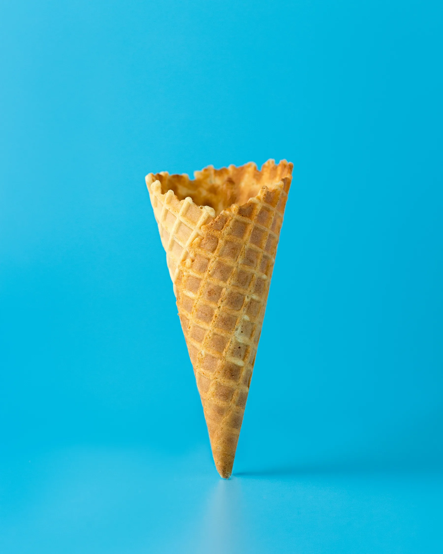 Crisp waffle cone on a blue background